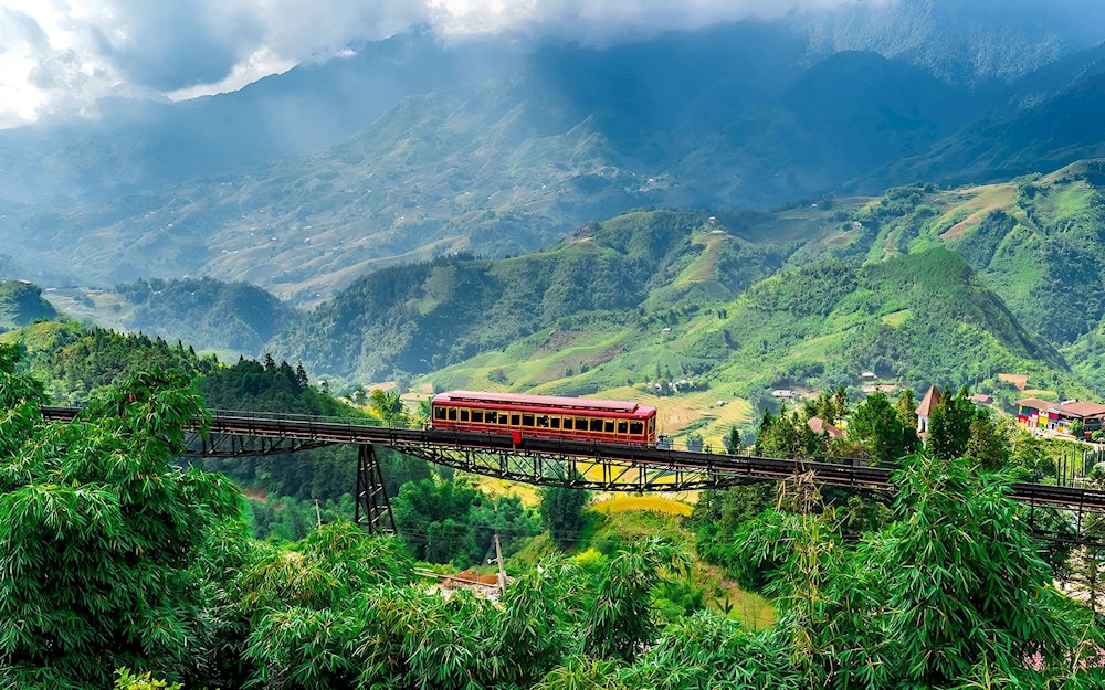 The Muong Hoa mountain train offers breathtaking aerial views of the valley's famous terraced rice fields from 1,600 meters above sea level 